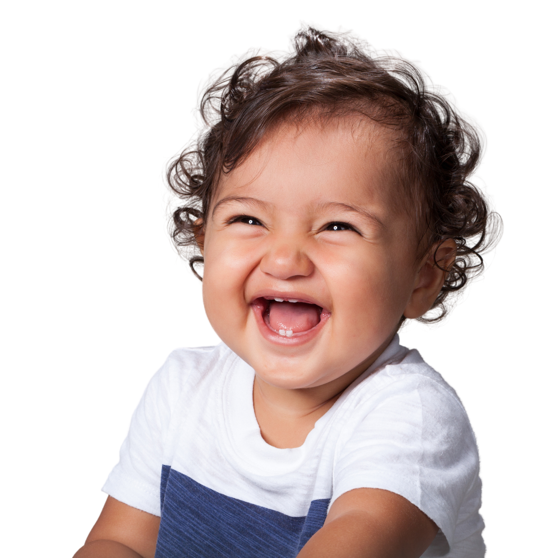 A close up of a laughing toddler with curly hair